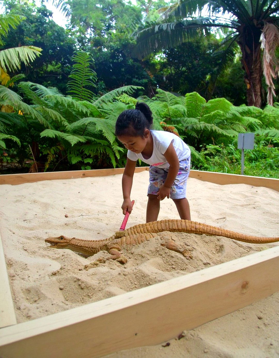 A Dinosaur Dig Site Playground - 30 kid friendly small backyard playground ideas