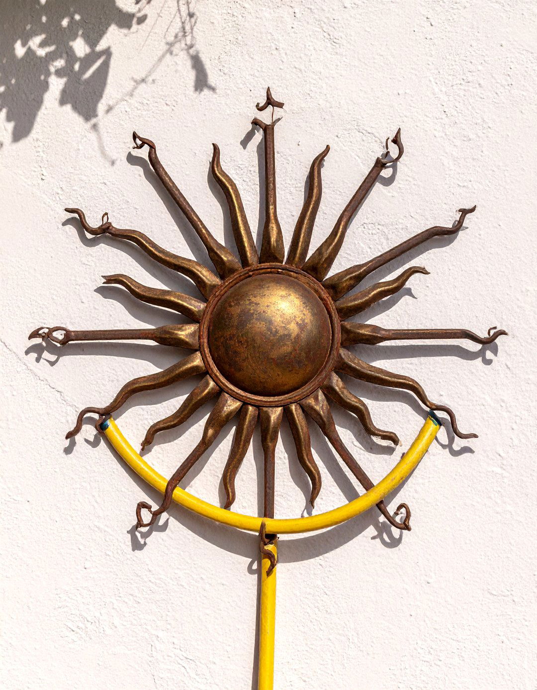 Artistic Welded Metal Hose Holder - 30 garden hose storage ideas