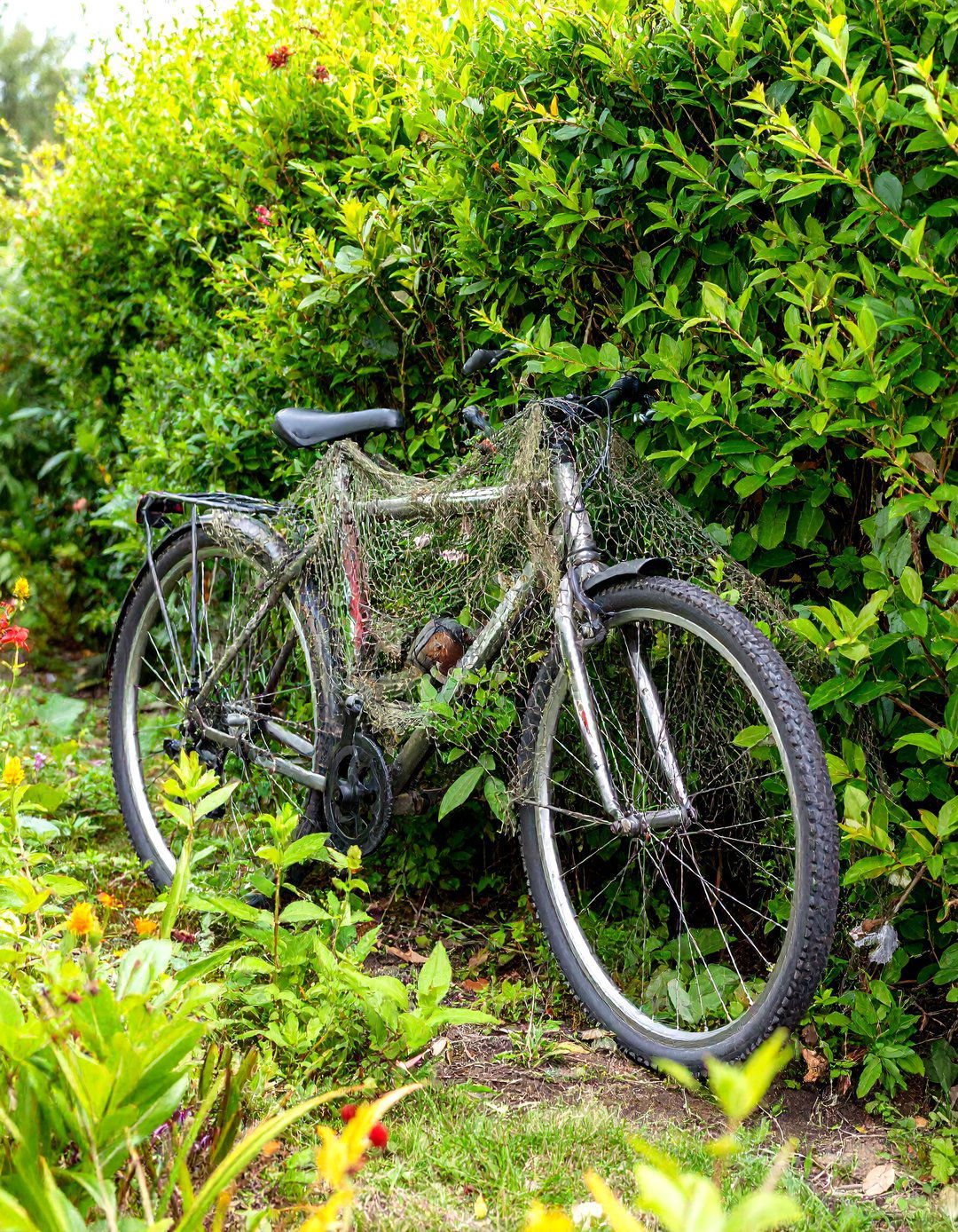 Camouflage Netting Bike Hideaway - 30 outdoor bike storage ideas