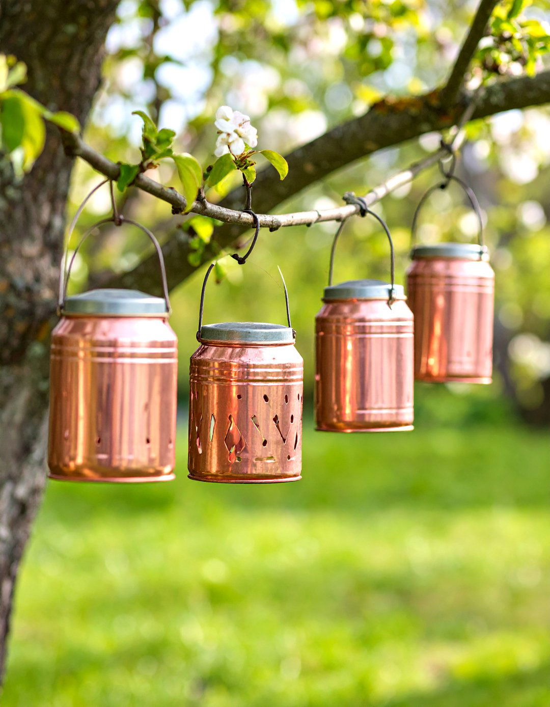 Recycled Tin Can Lanterns - 30 diy backyard lighting ideas