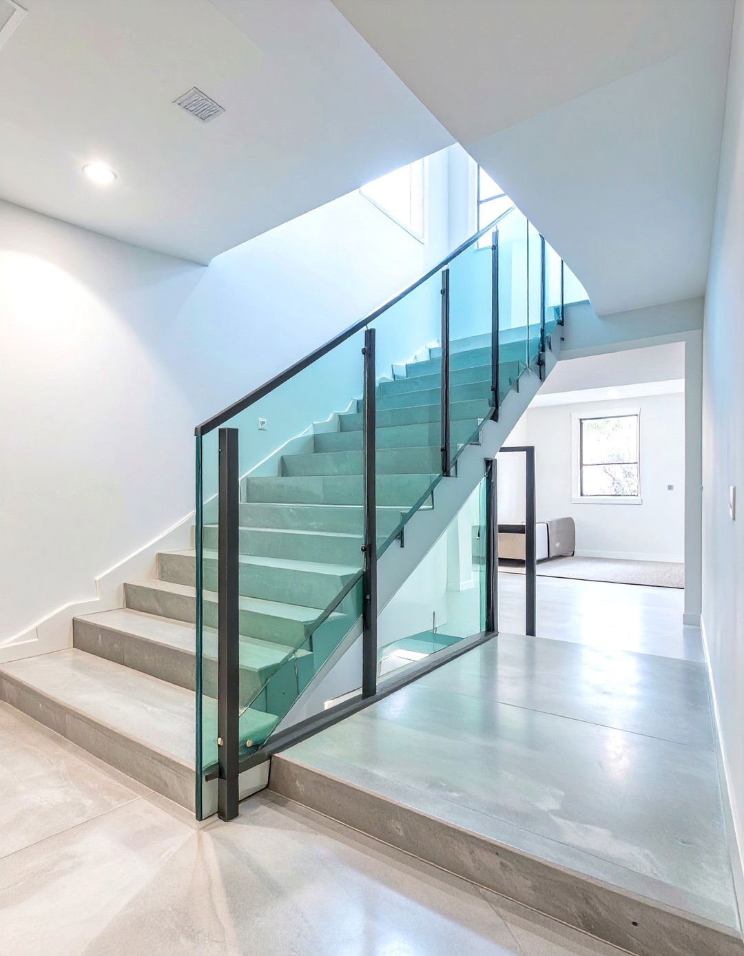 The Bright and Open Glass Railing Stairwell - 30 exterior basement entrance ideas