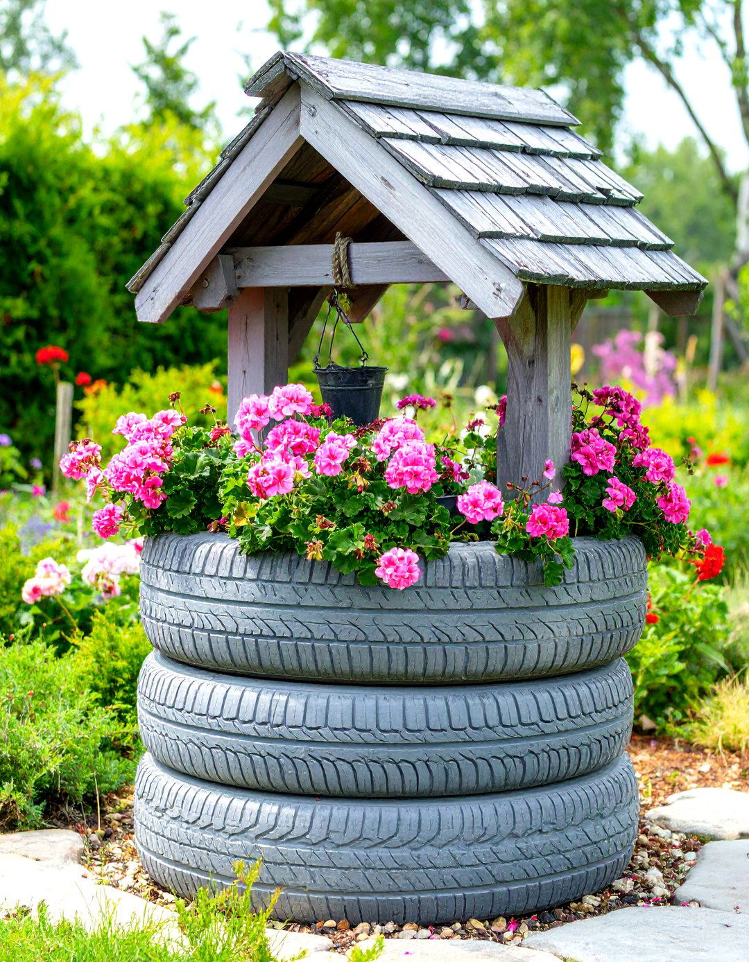The Tyre Garden Wishing Well - 30 creative landscape tyre garden designs