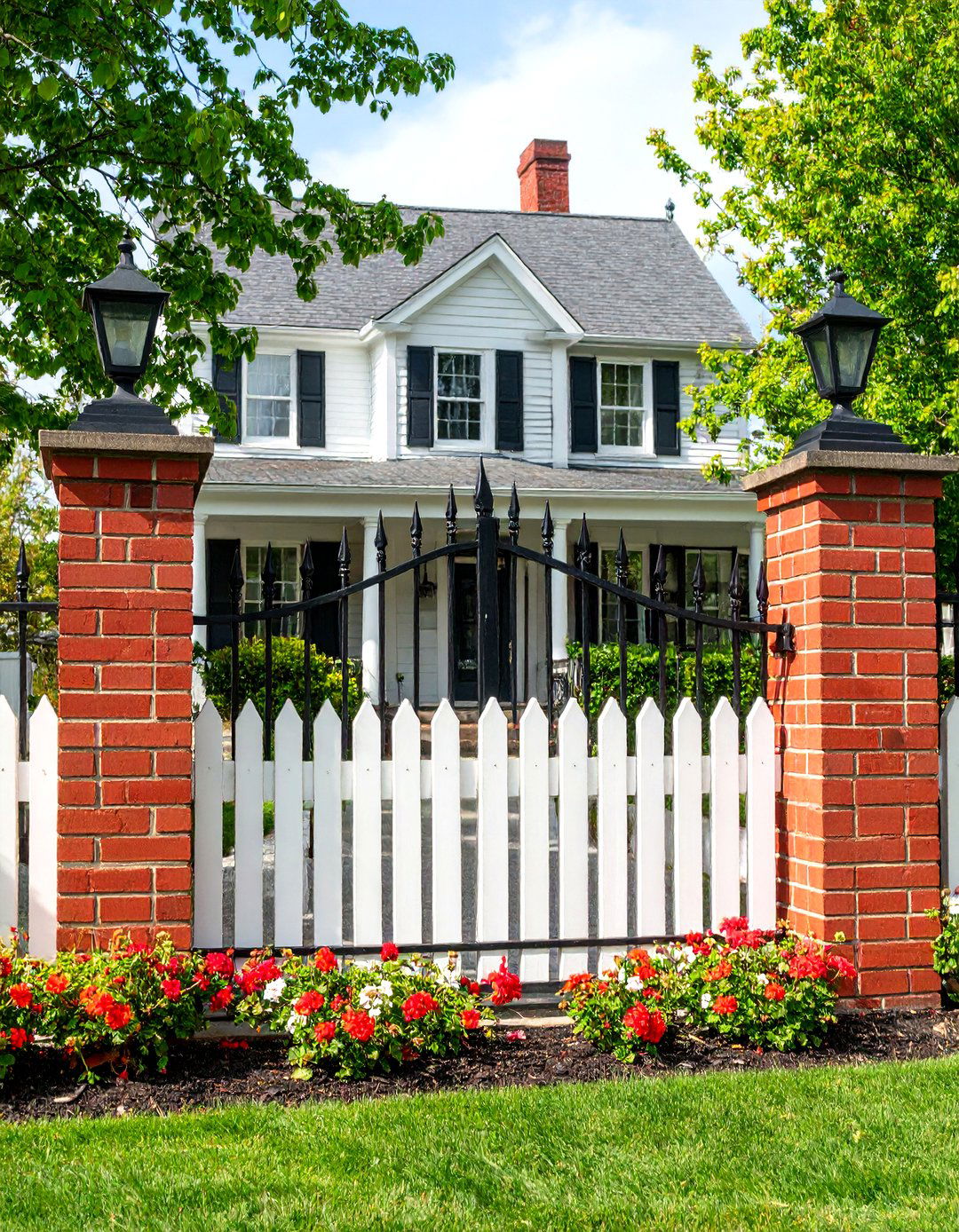 Traditional Brick Pillars with Iron Fence Panels - 30 front yard fence ideas with gate