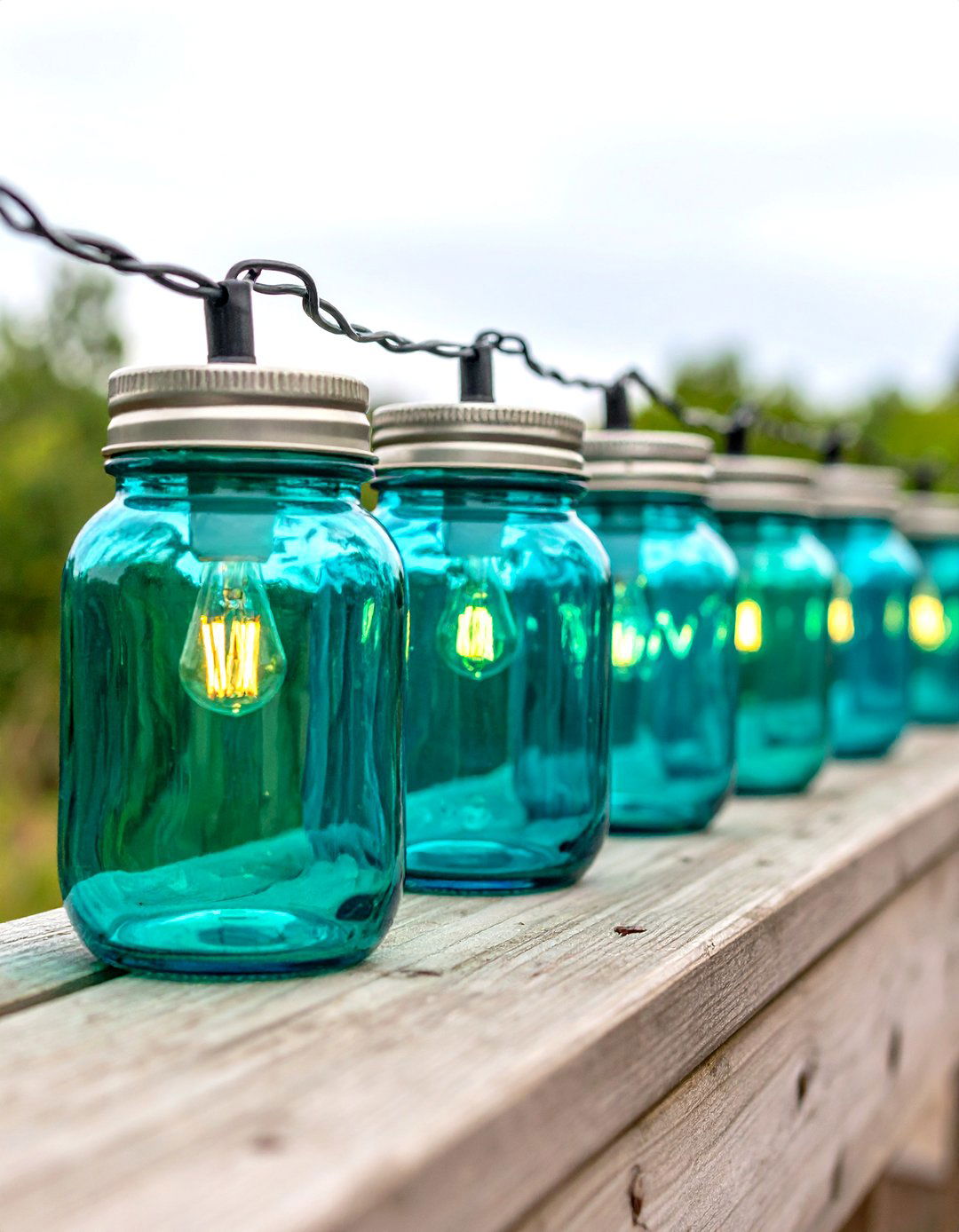 Upcycled Glass Insulator Lights - 30 diy backyard lighting ideas