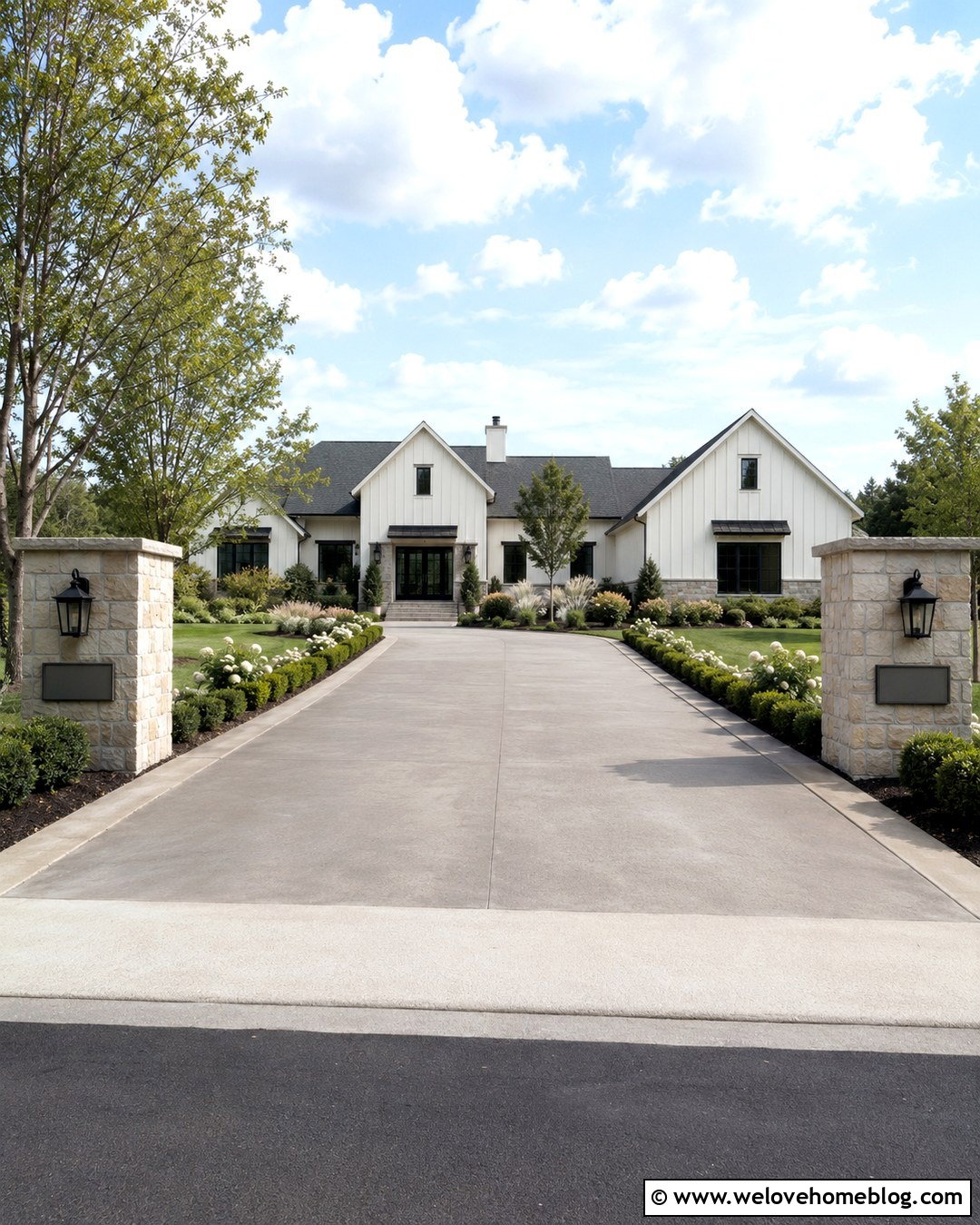 Cement Driveway With Lighted Entrance Pillars