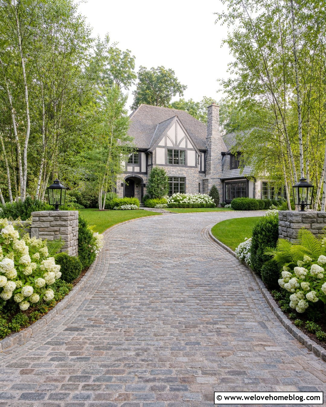 Cobblestone Driveway Entrance With Hydrangeas - 20 landscaped driveway entrance ideas