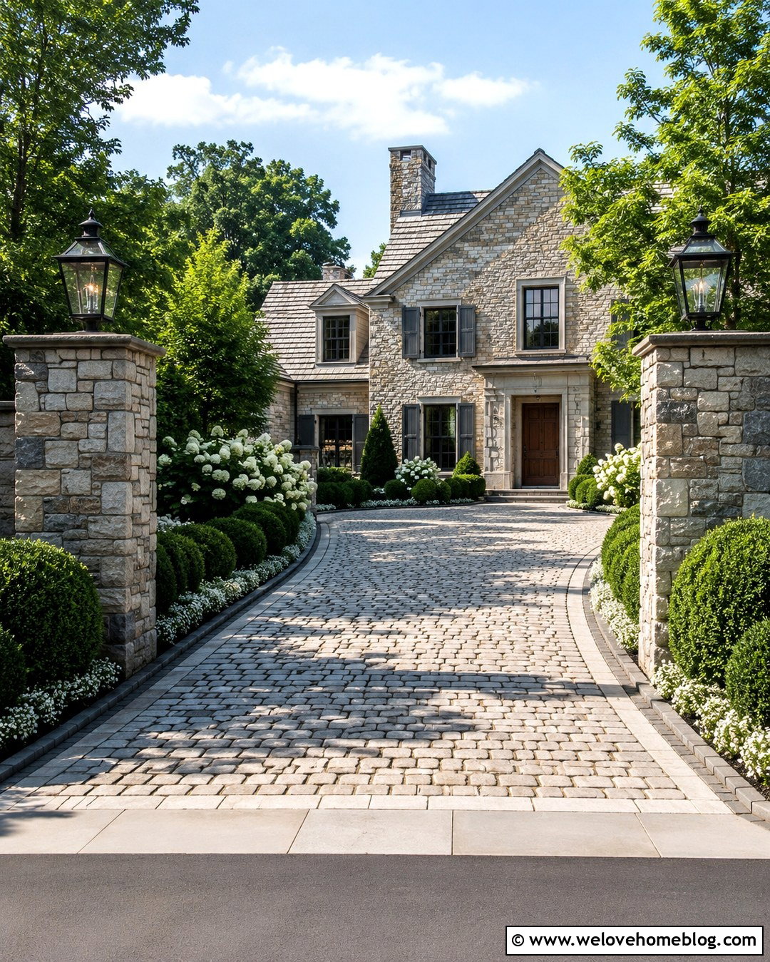 Cobblestone Driveway Entrance With Lantern Pillars - 20 Driveway Landscape For Entrance Ideas
