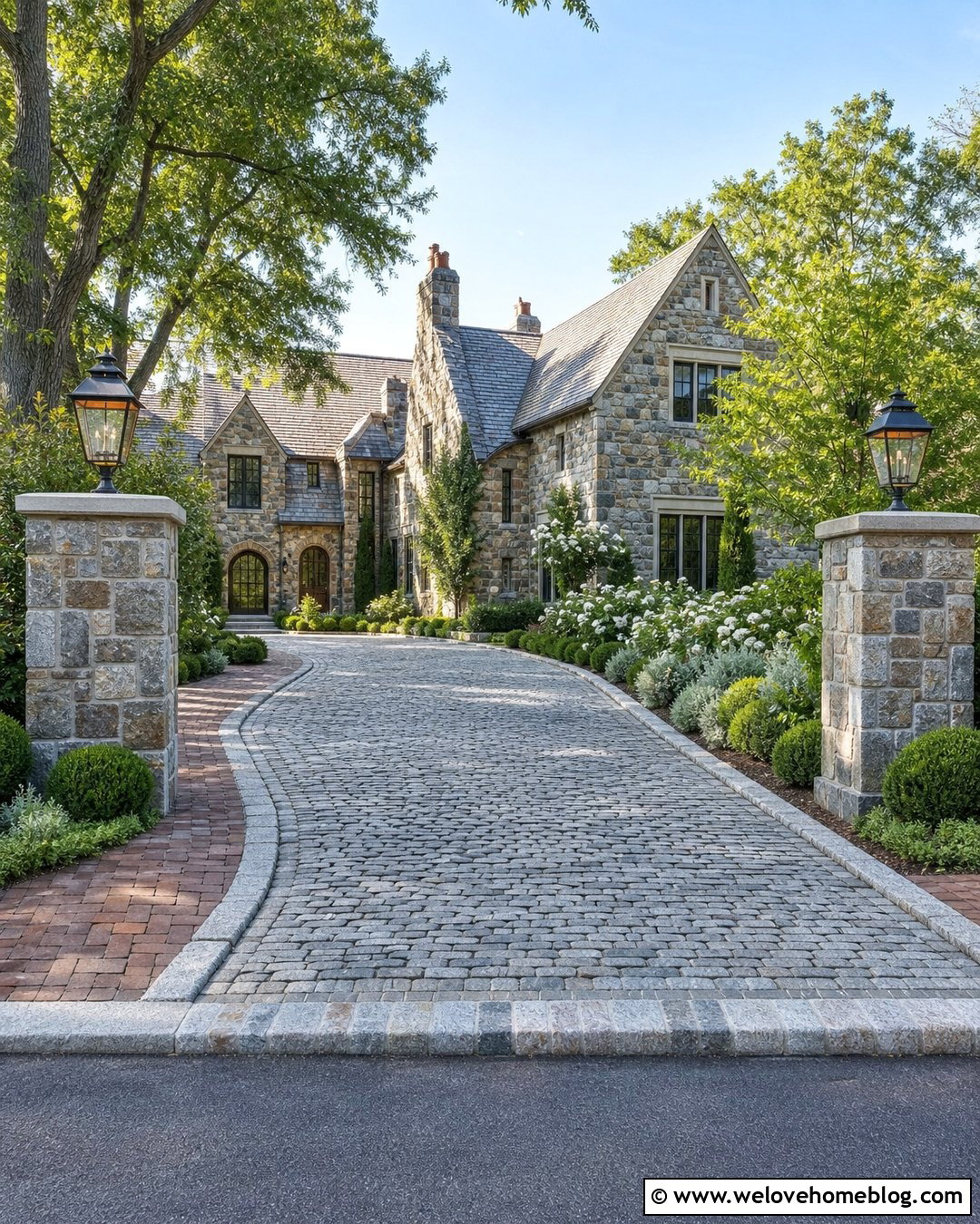 Cobblestone Driveway Entrance With Lantern Pillars - 20 Entryway Driveway Ideas