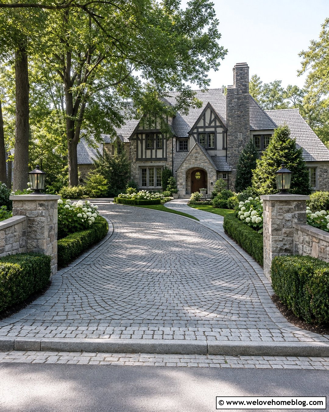 Cobblestone Driveway With Stone Pillars - 35 home driveway ideas