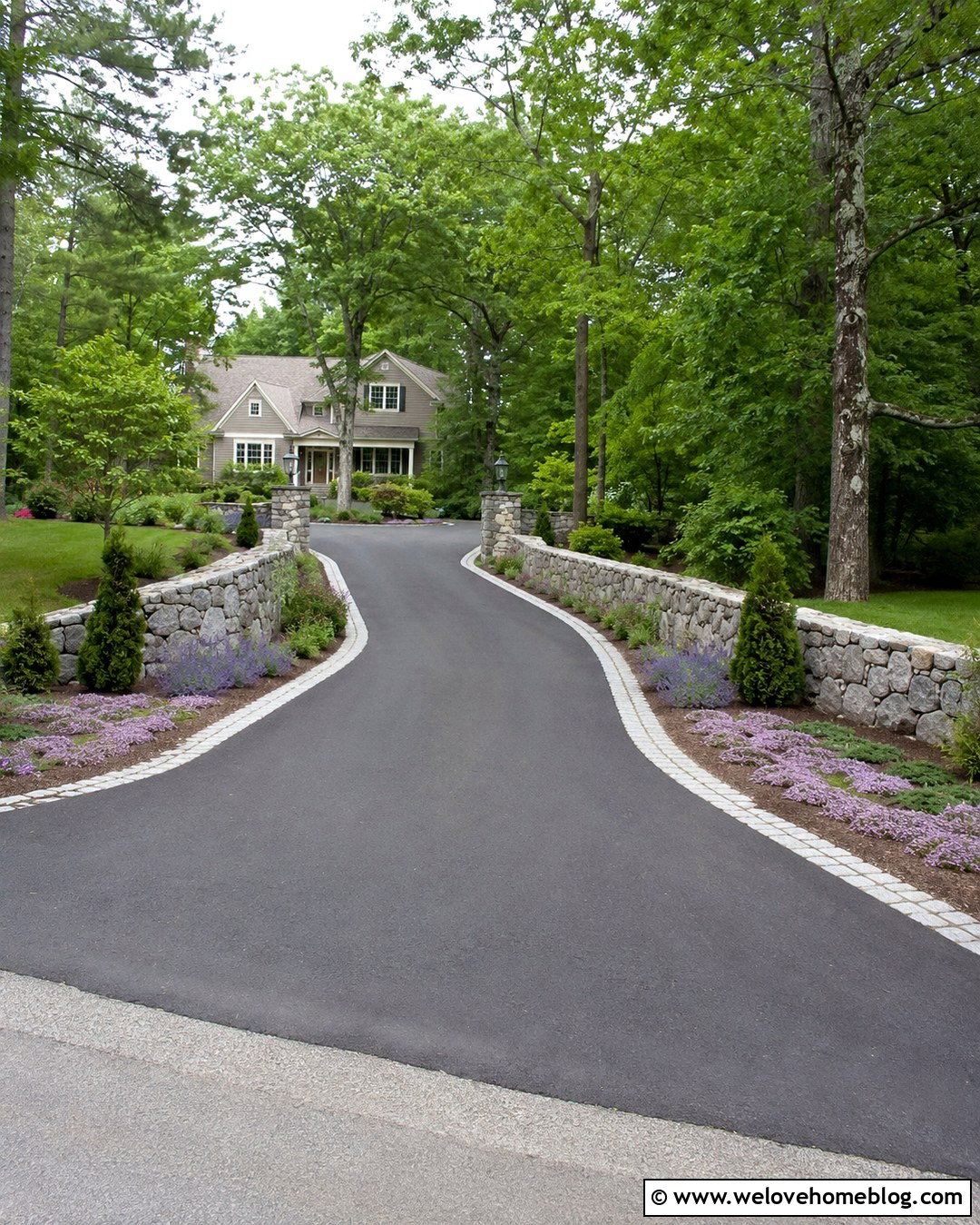 Curved Rock Wall With Asphalt Driveway - 20 Rock Wall Driveway Entrance Ideas