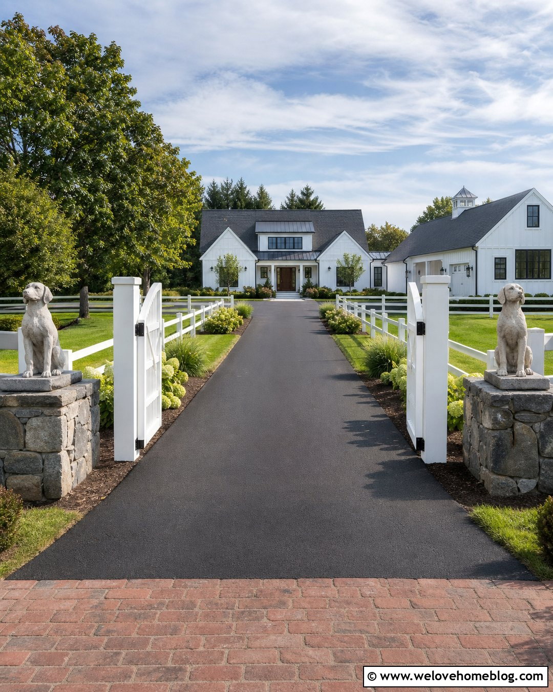 Dog Statues at a Farmhouse Driveway Gate