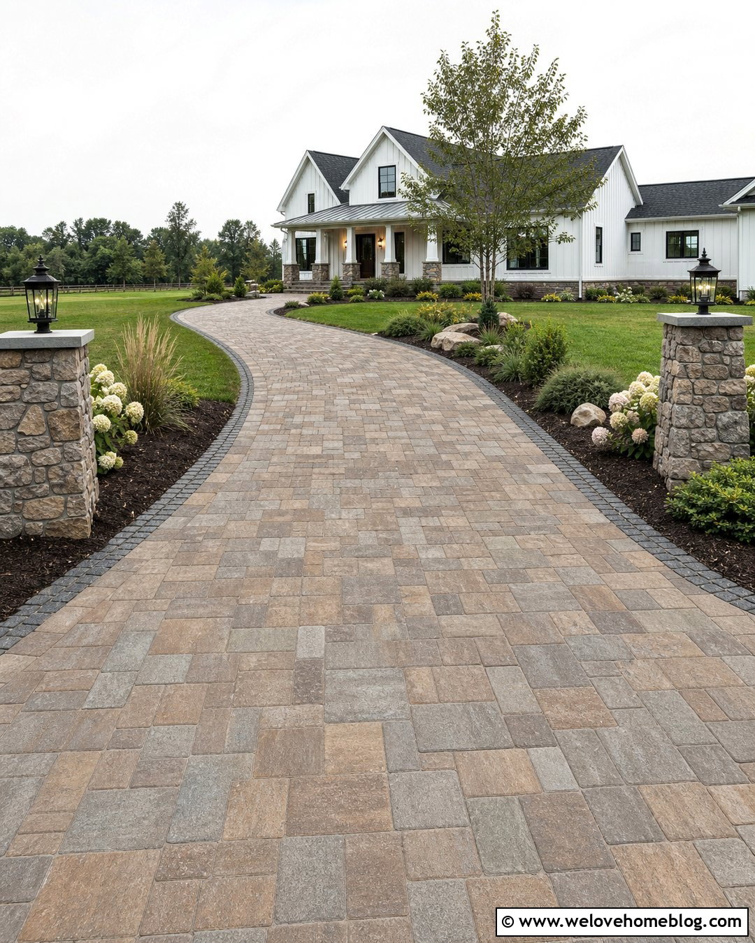 Farmhouse Paver Driveway With Stone Columns - 20 Paver Driveway Curb Appeal Ideas