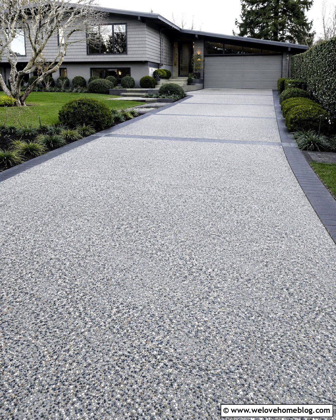 Gray Exposed Aggregate Driveway With Black Pavers - 20 Neutral Color Driveway Design Ideas
