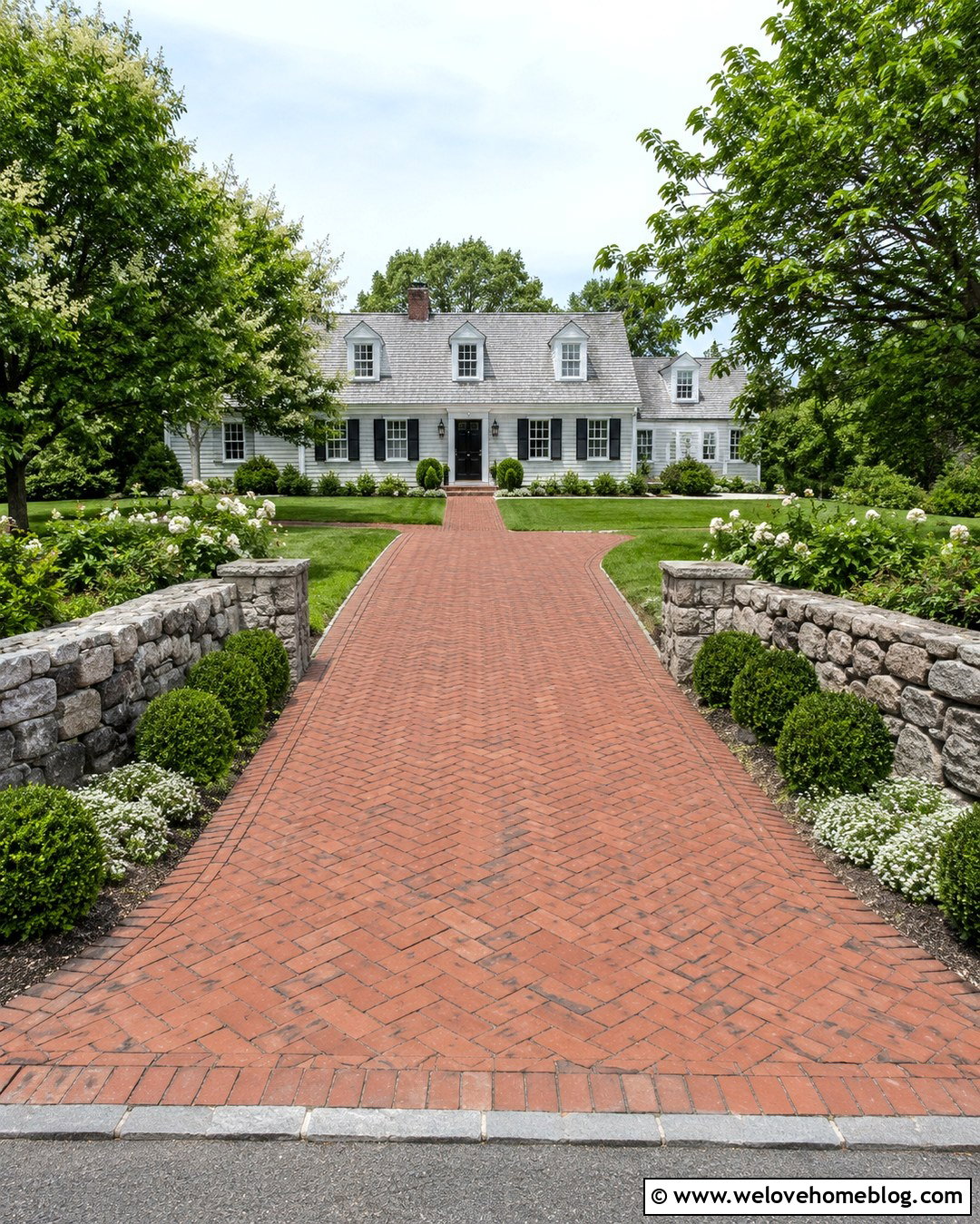 Low Rock Wall With Brick Driveway