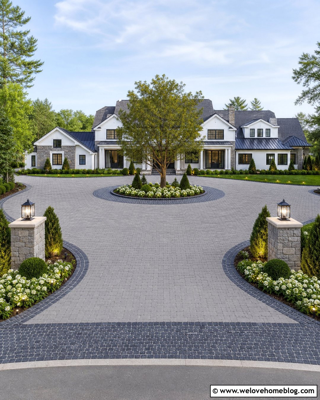 Mixed Paver Roundabout Driveway With Stone Entrance Pillars - 35 Round About Driveway Landscaping Ideas