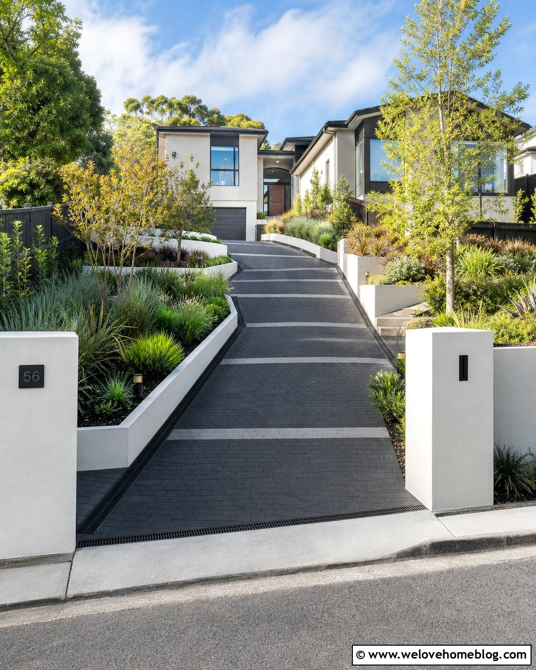 White Rendered Wall With Sloped Driveway